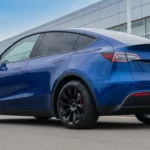 Infographic of Tesla Model Y Performance 2026 showing price, real-world range, acceleration, charging time, features, and EV comparison insights